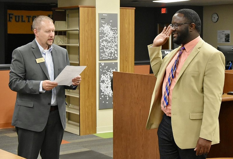 <p>Paula Tredway/FULTON SUN</p><p>Robert Vaughn was sworn in as the newest member of the Fulton Public School District 58 Board of Education during a special meeting Tuesday night in the high school library/media center. Vaughn replaces Verdis Lee Sr., who resigned in early June.</p>