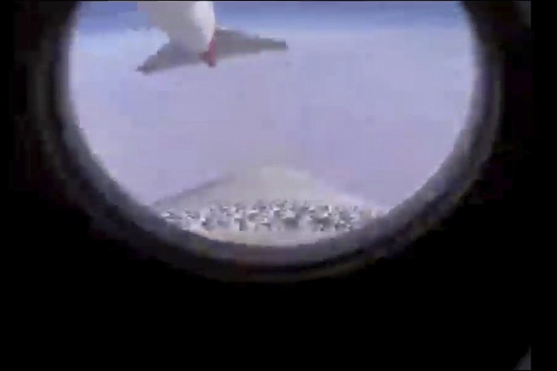 In this image from video made available by Virgin Orbit, the tail of a modified 747 jet is seen from the LauncherOne rocket as it separates from underneath the aircraft's wing over the Pacific Ocean, during a mission to deliver satellites from three countries into space on Wednesday, June 30, 2021. (Virgin Orbit via AP)