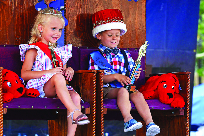 Penelope Luebbering, left, and Elias Mueller, right, sit on their thrones Friday night after being crowned Little Miss and Little Mr. Independence on the Madison Street Stage. Luebbering, 6, said she wants to be a doctor and a mom when she grows up. Mueller, 5, said he wants to be a paleontologist when he grows up.