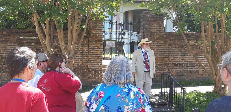 A guide taking on the persona of Charles Beatty Moore led downtown tourists on the first leg of the Memorial Walk held Saturday. The "Ace of Clubs House" was one of the first stops, a house that was owned by the Moore family during much of its history.