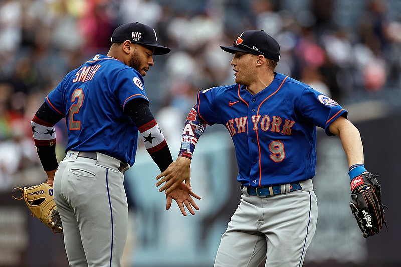 The New York Yankees celebrate their win after a baseball game