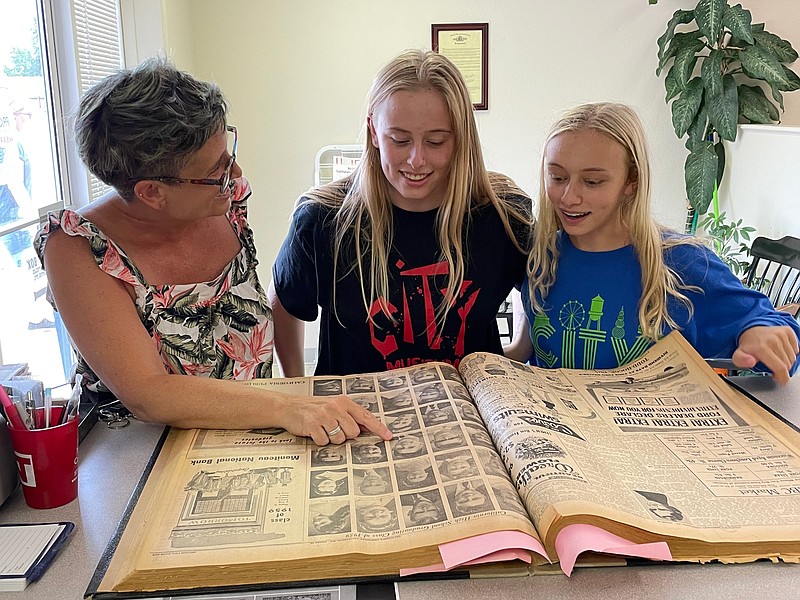 <p>Democrat photo/Kaden Quinn</p><p>The Cross family — mother Colette and daughters Parker, 18, and Lilian, 15 — recently made a stop in California in search of family history. Colette’s father, James “Gordy” Eckert, grew up in California, and the family was able to find details about Colette’s grandparents, Ray and Dorothy Eckert, while visiting the California Democrat.</p>