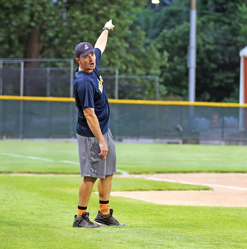 Shane Fontenot of the Jefferson City Renegades signals to Renegades assistant coach Caleb Thomas to hit a home run Wednesday during the team's celebrity softball game at Vivion Field.