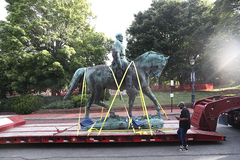 The monument of Robert E. Lee is removed on Saturday, July 10, 2021 in Charlottesville, Va.   The removal of the Lee and Jackson statues comes nearly four years after violence erupted at the infamous “Unite the Right” rally.  (Erin Edgerton/The Daily Progress via AP)