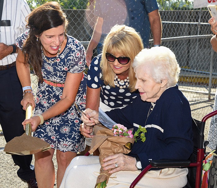 Missy Bonnot, middle, assists Betty "BJ" DeLong, seated, on Aug. 10, 2020, to scoop a miniature shovel of dirt out of a shovel held by Mayor Carrie Tergin during a groundbreaking ceremony for the Bicentennial Bridge. Bonnot, who serves as the president of the Jefferson City Area Chamber of Commerce, joined about 100 other interested parties as ground was officially broken on the northeast corner of the Capitol grounds. DeLong donated more than $3 million to the project.