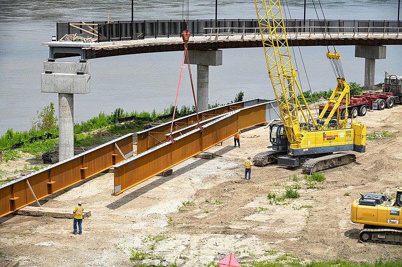 In this July 2021 photo, sets of steel delivered by DeLong's Steel will form the trusses for a stretch of the Bicentennial Bridge to Adrian's Island in Jefferson City. In all, four trusses will be set on the pier caps using two cranes controlled by Phillips Hardy operators.