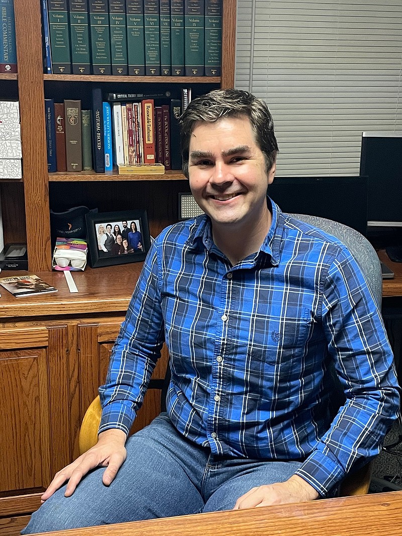 <p>Democrat photo/Kaden Quinn</p><p>Reverend Nicholas Van Dam sits in his new office at California United Methodist Church. Van Dam and his family recently made the move to California from Anderson.</p>