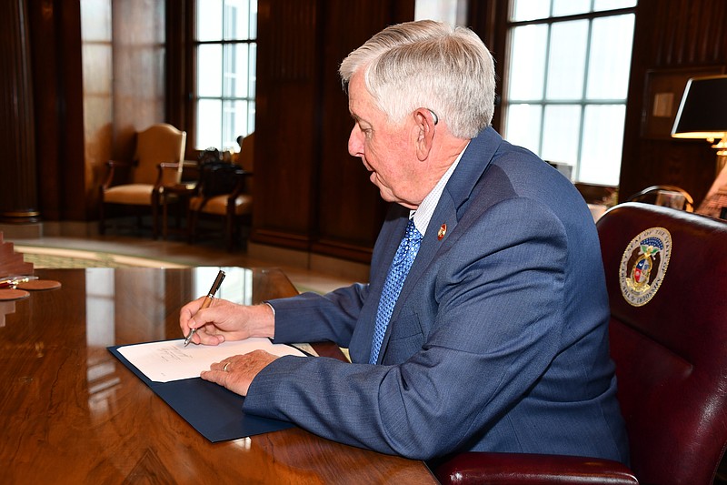 Missouri Gov. Mike Parson signs the fiscal year 2022 state budget on June 30. The new fiscal year began July 1. (Courtesy of the governor's office)