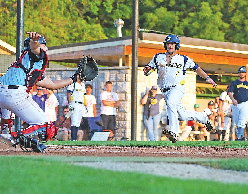 Tommy Ruether of the Jefferson City Renegades sprints home as Sedalia Bombers catcher Parker Serio awaits the throw ahead of a tag Tuesday night during a game at Vivion Field.
