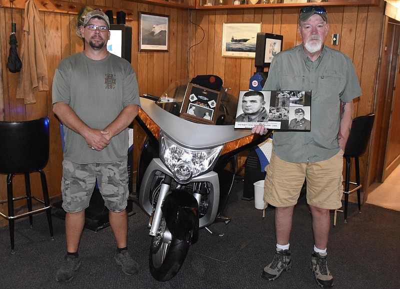 <p>Paula Tredway/FULTON SUN</p><p>Robert Bennett (left) and Bob White pose with the 2008 Victory Vision Tour motorcycle that White donated for a raffle at the VFW Post 2657 in honor of his late father, Robert L. White.</p>