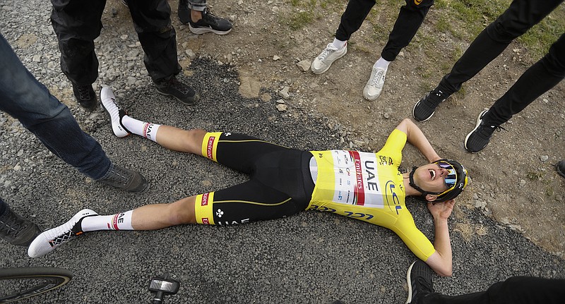Stage winner Slovenia's Tadej Pogacar, wearing the overall leader's yellow jersey, catches his breath Wednesday after the 17th stage of the Tour de France, which spanned 110.9 miles with a start in Muret and a finish in Saint-Lary-Soulan Col du Portet, France.