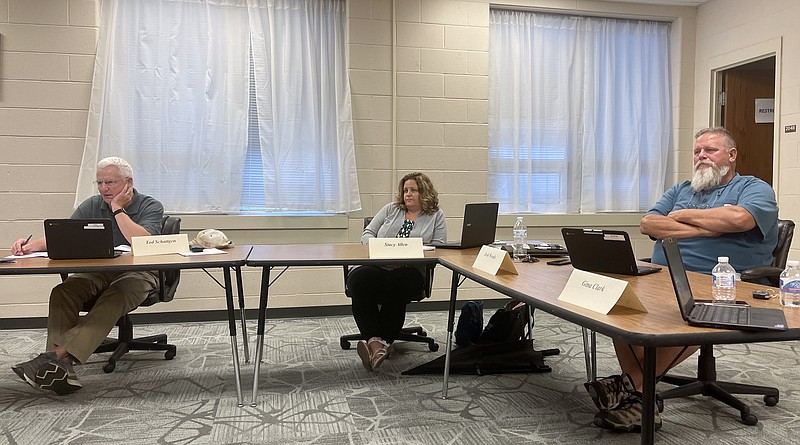 <p>Paula Tredway/For the News Tribune</p><p>New Bloomfield R-3 Board of Education President Tod Schattgen and board members Stacy Allen and Josh Woods listen to COVID-19 and summer project updates during the board’s meeting Thursday, July 15, 2021, in the Central Office meeting room in New Bloomfield.</p>