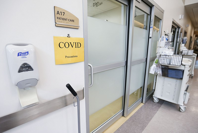 A patient room is marked with a sign noting the patient is COVID-19 positive in the CoxHealth Emergency Department, Friday, July 16, 2021, in Springfield, Mo. (Nathan Papes/The Springfield News-Leader via AP)