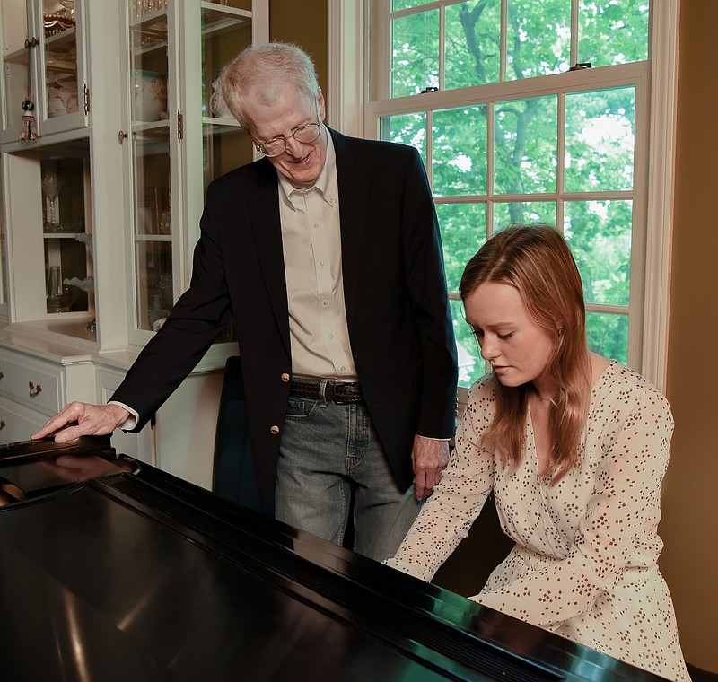Julie Smith/News Tribune
Jim Bryant is seen with his last student, Katy Mehan, in his piano studio where he's been teaching for decades.