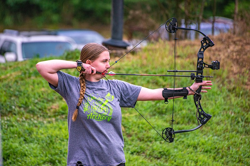 Madison Witt takes aim during the Cole County Fair 4-H Shoot Sports Competition Saturday at United Sportsmen's Club.  (Ken Barnes/News Tribune)