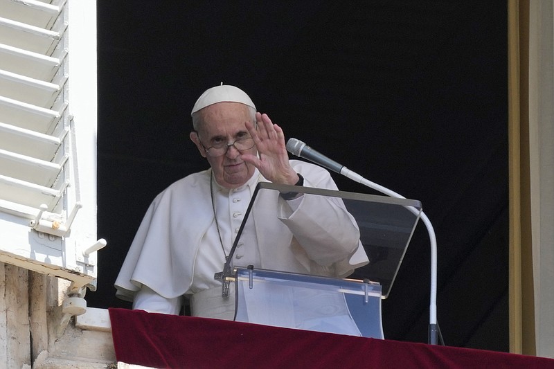 Pope Francis waves to the crowd as he leaves after delivering the Angelus noon prayer from the window of his studio overlooking St.Peter's Square, at the Vatican, Sunday, July 18, 2021. (AP Photo/Alessandra Tarantino)