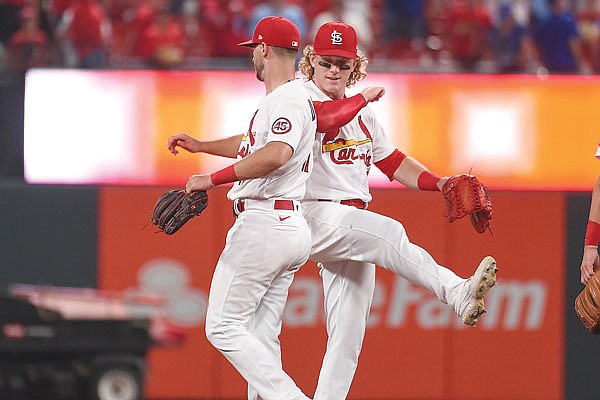 Cardinals shortstop Paul DeJong (left) and outfielder Harrison Bader celebrate after Monday night's 8-3 win against the Cubs at Busch Stadium.