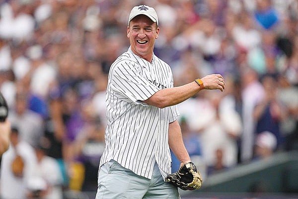 Peyton Manning throws the ceremonial first pitch prior to the MLB All-Star Game last Tuesday in Denver.