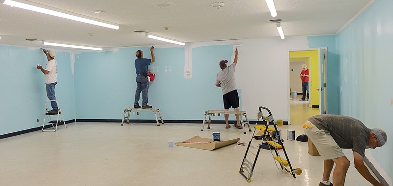 Pictured from left, Steve Fitts, Ricky Draper, Frank Lanier and Bruce LeGrow are members of the Fishermen's Sunday School class who are painting a new children's center. Also working are Charles Snowden, Nathan Trammel and Christian Trammel.