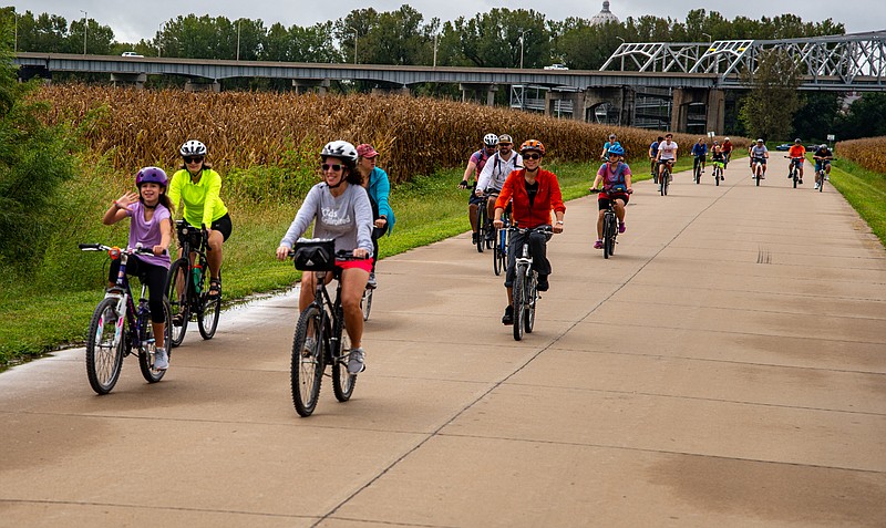 News Tribune fileAbout 30 bicyclists head out last year on a 10-mile Community Bike Ride. In addition to the monthly community rides, JC Parks is organizing a 15-mile moonlight ride setting off at 2 a.m. Sunday morning.