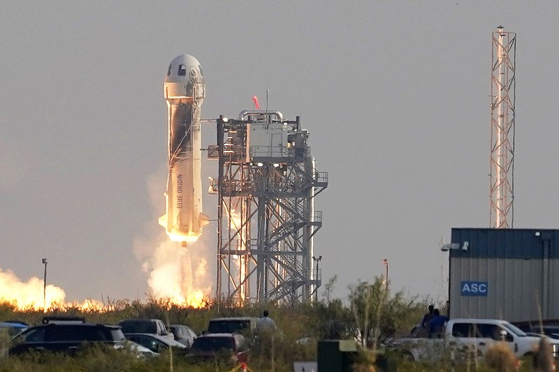 Blue Origin's New Shepard rocket launches carrying passengers Jeff Bezos, founder of Amazon and space tourism company Blue Origin, his brother Mark Bezos, Oliver Daemen and Wally Funk, from its spaceport near Van Horn, Texas, Tuesday, July 20, 2021. (AP Photo/Tony Gutierrez)