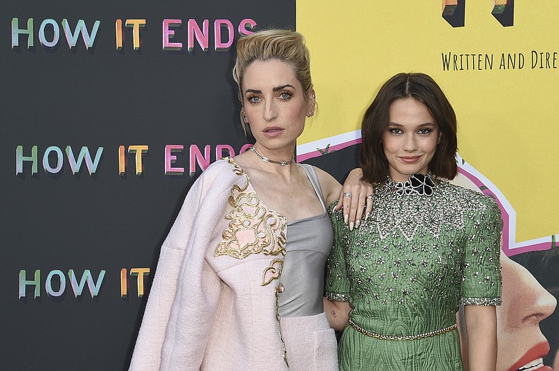 Zoe Lister-Jones, left and Cailee Spaeny arrive at the Los Angeles premiere of "How It Ends" at NeueHouse Hollywood on Thursday, July 15, 2021, in Los Angeles. (AP Photo/Richard Shotwell)