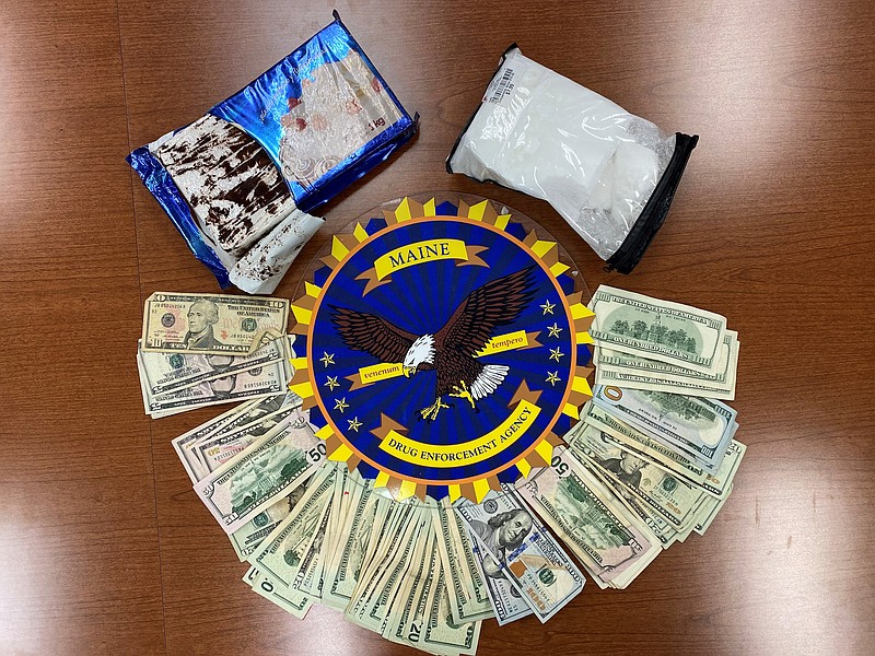 This undated photo provided by the Maine Drug Enforcement Agency shows a marble cake which contained about 2 pounds of cocaine, and cash, seized from a vehicle in Gardiner, Maine. A New York man and a Maine woman are facing charges, Wednesday, July 21, 2021, after the cocaine disguised as a cake was seized from their vehicle, authorities said. (Maine Drug Enforcement Agency via AP)