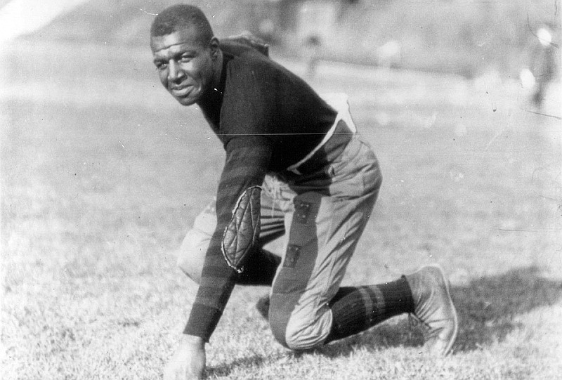 Iowa football player Frederick "Duke" Slater poses for a photo in 1921  Slater was the NFL's first African-American lineman, and often the only Black player on the field. After retiring, he broke down more racial barriers to become a judge in Chicago. (Chicago Sun-Times via AP)