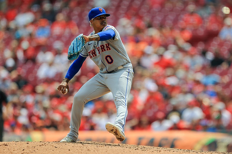 New York Mets' Marcus Stroman throws during the seventh inning of a baseball game against the Cincinnati Reds in Cincinnati, Wednesday, July 21, 2021. (AP Photo/Aaron Doster)