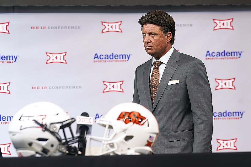 Oklahoma State coach Mike Gundy walks onto the stage to speak during Big 12 Media Days last Thursday in Arlington, Texas.