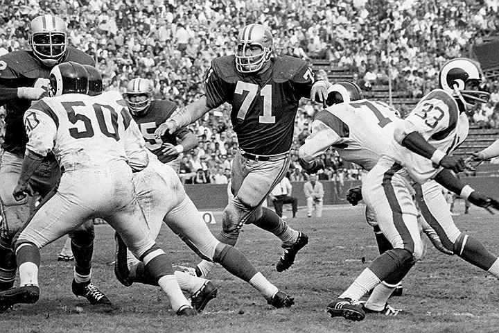 In this undated file photo, Detroit Lions defensive tackle Alex Karras (71) plays against the Los Angeles Rams. Karras' installment into the Pro Football Hall of Fame should put to rest years of speculation about why he wasn't inducted sooner. (Detroit Lions via AP)