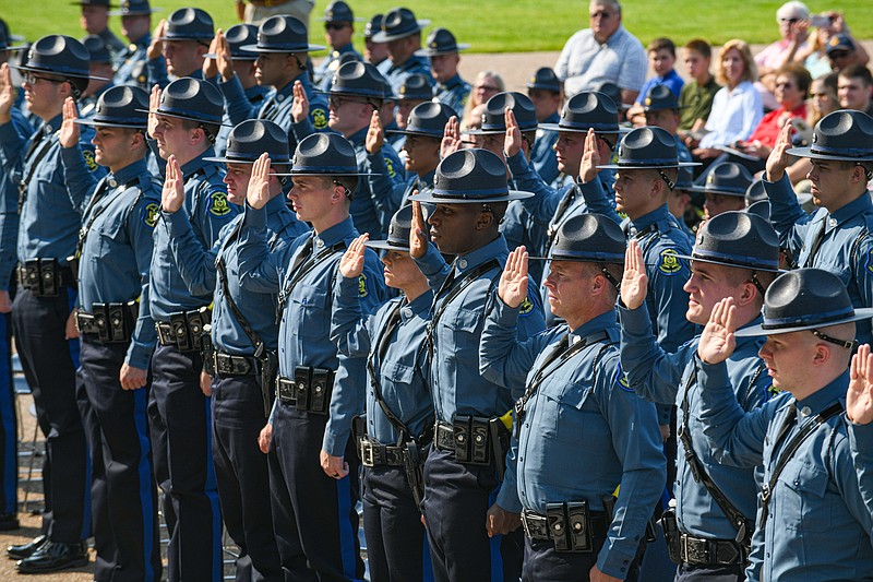 Julie Smith/News Tribune
Twenty nine recruits to the 111 Recruit Class to the Missouri State Highway Patrol repeat the oath of office as trooper during commencement ceremonies Friday on the Capitol's south steps. All are now MSHP troopers following recitation of the oath administered by Missouri Supreme Court Justice Patricia Breckenridge.