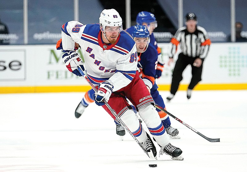 In this April 11 file photo, Pavel Buchnevich of the Rangers skates with the puck during the third period of a game against the Islanders in Uniondale, N.Y.