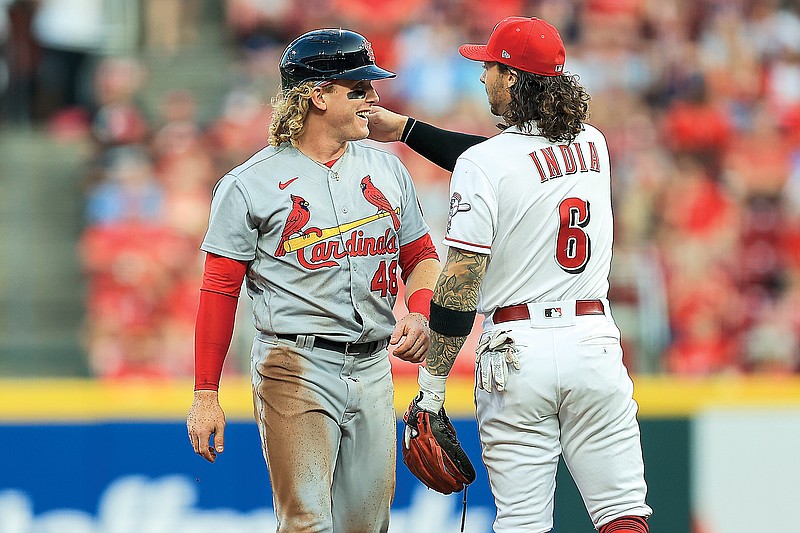 Harrison Bader of the Cardinals talks with Reds second baseman Jonathan India during Friday's game in Cincinnati.