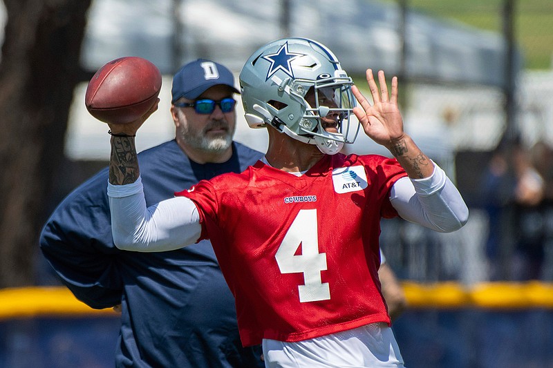 Dallas Cowboys safety Xavier Woods warms up before an NFL football