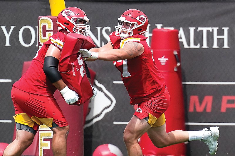In this June 16 file photo, Chiefs offensive guards Laurent Duvernay-Tardif (left) and Andrew Wylie participate in a drill during the team's minicamp in Kansas City.