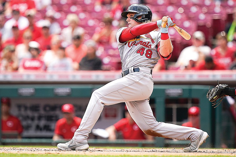 Harrison Bader of the Cardinals hits a three-run home run during the fourth inning of Sunday afternoon's game against the Reds in Cincinnati.