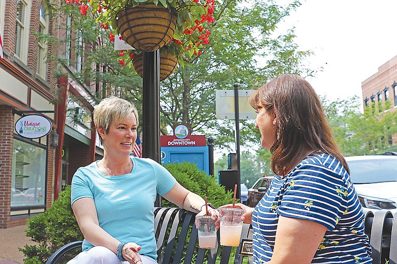 Shonda Czeschin Fischer, a Christian romance author, enjoys an afternoon discussing writing with her friend Stacey Hamner on Thursday, July 22, 2021, in downtown Jefferson City. 