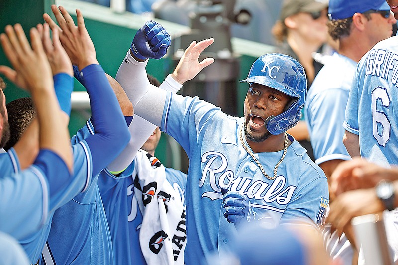 Jorge Soler celebrates with his Royals teammates in the dugout after hitting a solo home run during the third inning of Sunday afternoon's game against the Tigers at Kauffman Stadium in Kansas City.