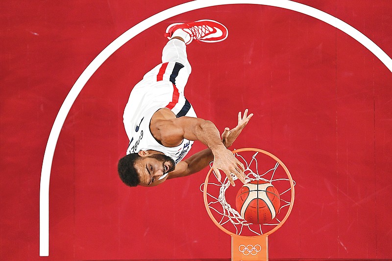 France's Rudy Gobert dunks the ball during Sunday's preliminary round game against the United States at the 2020 Summer Olympics in Saitama, Japan. France won 83-76.