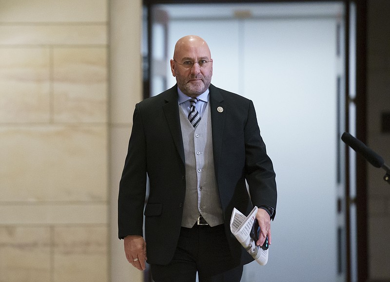 FILE - Rep. Clay Higgins, R-La., arrives at the Capitol in Washington, Friday, May 14, 2021. Higgins, who represents southwest Louisiana, said he, his wife and son have contracted the coronavirus. Higgins made the announcement Sunday, July 25, 2021 on his Facebook page. The Republican representative said he and his wife previously contracted the virus in 2020 but said this time around was much more difficult. (AP Photo/J. Scott Applewhite, file)