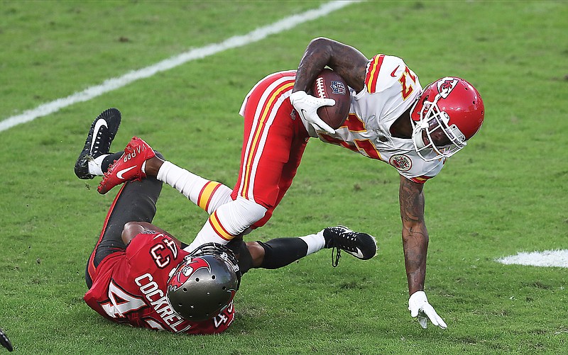 In this Nov. 29, 2020, file photo, Chiefs wide receiver Mecole Hardman is tackled by Buccaneers defensive back Ross Cockrell during the first half of game in Tampa, Fla.