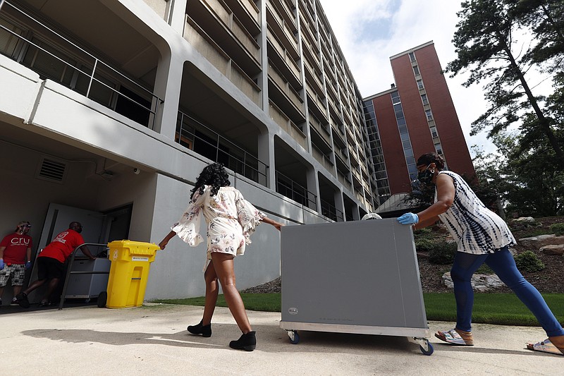 FILE - College students begin moving in for the fall semester at N.C. State University in Raleigh, N.C., Friday, July 31, 2020.  By the end of the U.S. head count last year, the Census Bureau lacked data for almost a fifth of the nation's occupied college dorms, nursing homes and prisons, requiring the statistical agency to make eleventh-hour calls to facilities in an effort to collect resident information or use a last-resort statistical technique to fill in the gaps. (AP Photo/Gerry Broome, file)