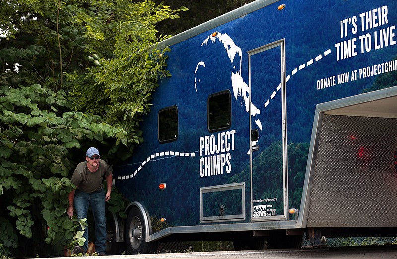 Workers from Project Chimps of Blue Ridge, Georgia, leave a Festus-area facility in the 12300 block of County Road CC in Maryland Heights, Mo., after taking away chimpanzees under a judge's order on Wednesday, July 28, 2021. The caretaker of the animals, Tonia Haddix, was under a court order to turn over all of the chimps to representatives of the People for the Ethical Treatment of Animals. The judge's order capped a years long dispute over the fate of the chimps, after a 2016 PETA lawsuit claimed that chimps were being held in inadequate conditions at the Missouri Primate Foundation facility. The suit said the chimps' treatment violated the federal Endangered Species Act. (Robert Cohen/St. Louis Post-Dispatch via AP)
