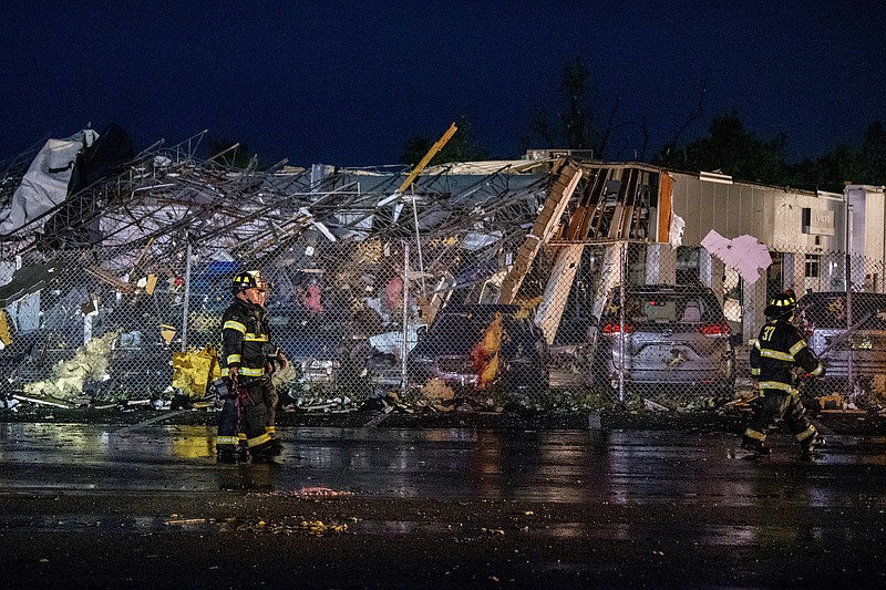 The scene at Faulkner Auto Group service center after a tornado hit in Trevose, Pa. Thursday, July 29, 2021. Five people were injured Thursday when a building at a Bensalem auto dealership was destroyed by severe weather, authorities said. The National Weather Service confirmed two tornados touched down in Bucks County, sending trees falling and debris flying.(Tom Gralish/The Philadelphia Inquirer via AP)