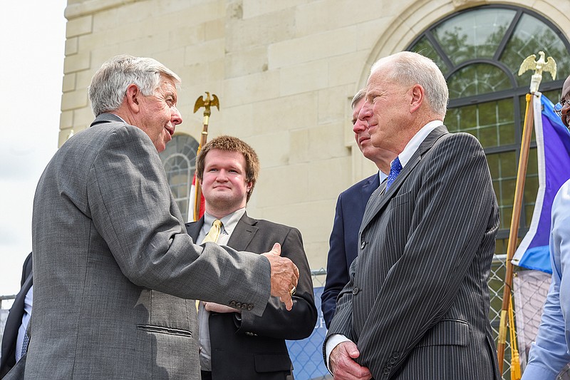 Following the brief ceremony Friday, Gov. Mike Parson, left, visited with ceremony participants in the festivities. Standing with Parson are, counter clockwise from right, Donald Lofe, Jr, Timothy Riley and Stephen Rogers. 