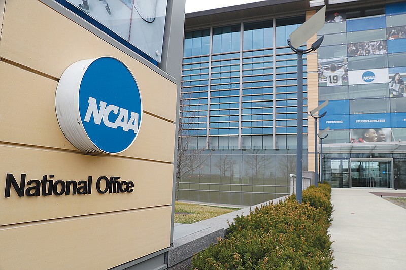 In a March 12, 2020, file photo, the outside of the NCAA headquarters is shown in Indianapolis.