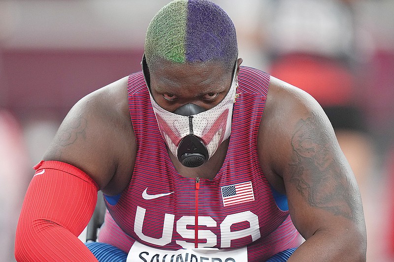 Raven Saunders of United States rests during throws in Friday's qualification rounds of the women's shot put at the 2020 Summer Olympics in Tokyo.