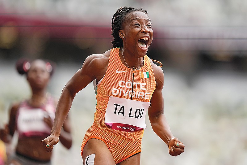 Marie-Josee Ta Lou of the Ivory Coast celebrates Friday after winning her heat in the women's 100-meter dash at the 2020 Summer Olympics in Tokyo.