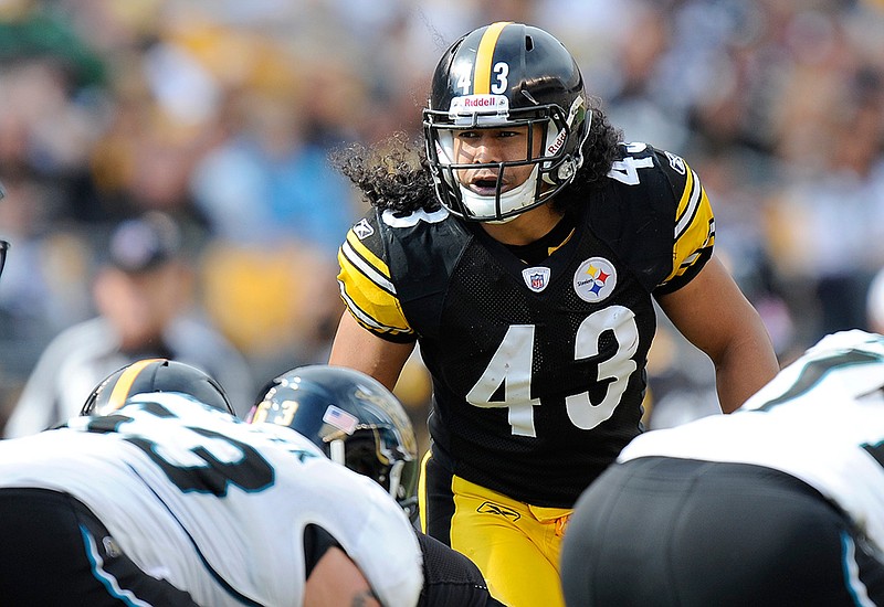 In this Saturday, Oct. 16, 2011, file photo, Pittsburgh Steelers strong safety Troy Polamalu (43) lines up against the Jacksonville Jaguars during the second quarter of a football game in Pittsburgh.  His long hair — a tribute to his Samoan roots — spilling out from under his helmet onto the top of his No. 43 jersey, Polamalu careened from one side of the field to the next for 12 seasons in Pittsburgh. (AP Photo/Don Wright, File)